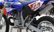 You’ve got to admit, it’s pretty cool to see a kick stand come stock on a blue 250cc two-stroke!